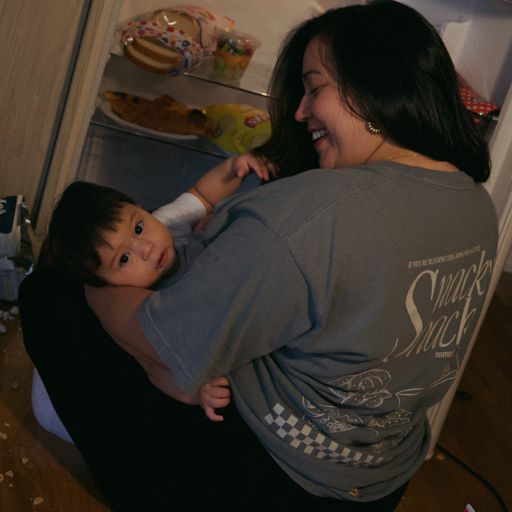 [main] A mom wearing a grey T-shirt with the phrase "if you&