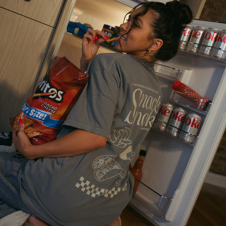 [main] A mom wearing a grey T-shirt with the phrase "if you&